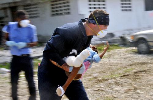 A powerful aftershock hits Haiti's capital Port-au-Prince at 6:03 a.m. local time (1103 GMT) on early Wednesday, Jan. 20, 2010. The quake measured 6.1 on the Richter scale, and its epicenter is about 60 km west of the capital, according to the U.S. Geological Survey. (Xinhua/AFP Photo)