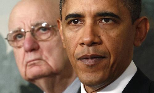 U.S. President Barack Obama speaks about financial reform after his meeting with Presidential Economic Recovery Advisory Board Chair Paul Volcker (L) at the White House in Washington January 21, 2010. (Xinhua/Reuters Photo)
