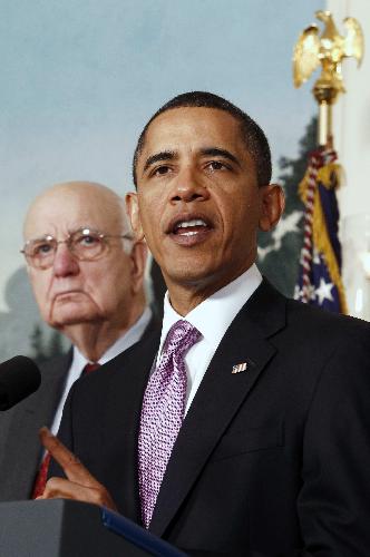 U.S. President Barack Obama speaks about financial reform after his meeting with Presidential Economic Recovery Advisory Board Chair Paul Volcker (L) at the White House in Washington January 21, 2010. (Xinhua/Reuters Photo)