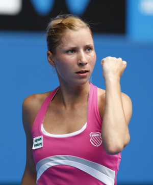 Alona Bondarenko of Ukraine celebrates scoring during the women's singles third round match against Jelena Jankovic of Serbia at the 2010 Australian Open tennis tournament in Melbourne, Australia, on Jan. 22, 2010. Bondarenko won 2-0.(Xinhua/Wang Lili)