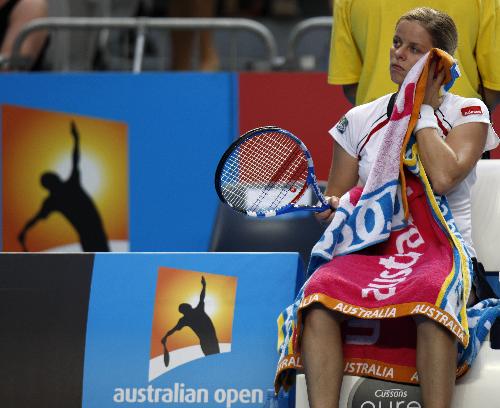 Kim Clijsters of Belgium rests during the third round match of women's singles agasint Nadia Petrova of Russia in 2010 Australian Open Tennis Championship at Rod Laver Arena in Melbourne Park, Jan.22, 2010. Clijsters lost 0-2. 