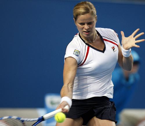 Kim Clijsters of Belgium returns the ball during the third round match of women's singles agasint Nadia Petrova of Russia in 2010 Australian Open Tennis Championship at Rod Laver Arena in Melbourne Park, Jan.22, 2010. Clijsters lost 0-2.