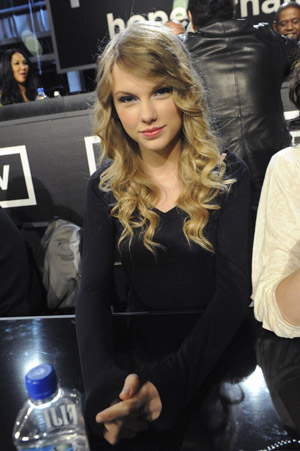 Singer Taylor Swift waits to answer phones during the 'Hope For Haiti Now: A Global Benefit For Earthquake Relief' telethon in Los Angeles, California January 22, 2010.