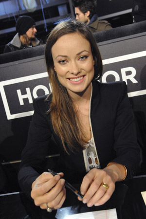 Actress Olivia Wilde waits to answer phones during the 'Hope For Haiti Now: A Global Benefit For Earthquake Relief' telethon in Los Angeles, California January 22, 2010.(
