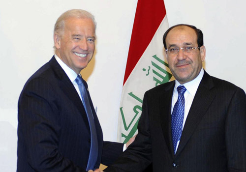 Iraq's Prime Minister Nuri Al-Maliki (R) shakes hands with U.S. Vice President Joe Biden as they pose during Biden's visit to Baghdad January 23, 2010. [Xinhua]