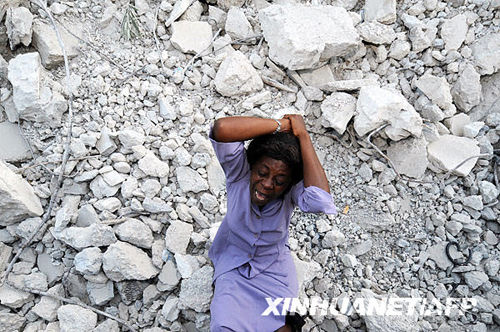 A woman cries at the site in Port-au-Prince, Haiti, Jan. 23, 2010. Her husband died in the 7.3-magnitude earthquake.
