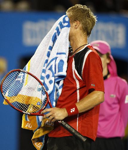 Lleyton Hewitt of Australia wipes his sweat during the fourth round match of men's singles against Roger Federer of Switzerland in 2010 Australian Open Tennis Championship in Melbourne, Australia, Jan. 25, 2010. (Xinhua/Wang Lili)