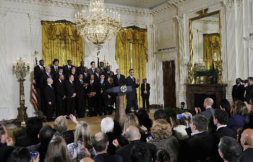 U.S. President Barack Obama attends a ceremony honoring the 2009 NBA basketball champions Los Angeles Lakers in the East Room at the White House in Washington, January 25, 2010.(Xinhua/Zhang Jun)