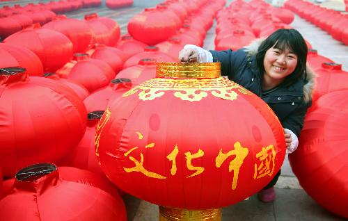 A local farmer airs newly-made red lanterns at a big yard in Hongmiao Village in Huairou District in Beijing, the capital of China, Jan. 26, 2010. The mountain village enjoyed a long history for producing Chinese traditional red lanterns in winter to meet the large demand from the festival market as the Spring Festical, the Chinese lunar new year, approaching. [Xinhua]