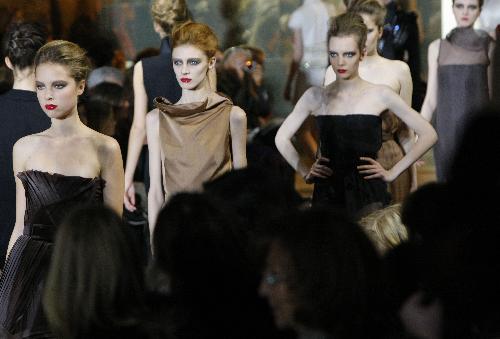 Models present creations of French designer Stephane Rolland during a fashion show in Paris, capital of France, Jan. 26, 2010.