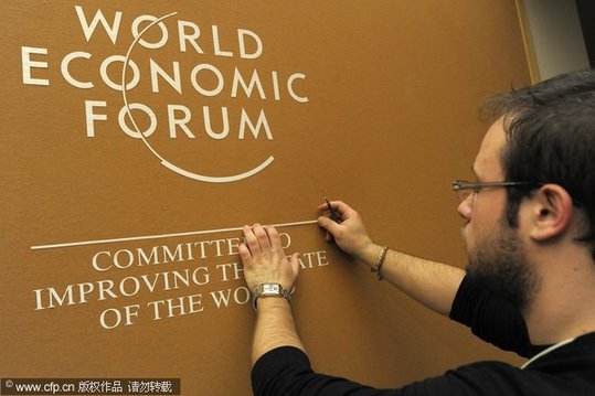 a worker makes last preparations inside the congress center two days before the opening of the 40th annual meeting of the world economic forum, wef, in davos, switzerland, monday, january 25, 2010. the overarching theme of the world economic forum, wef, annual meeting which will take place from jan. 27 to 31, is &apos;improve the state of the world: rethink, redesign, rebuild&apos;.