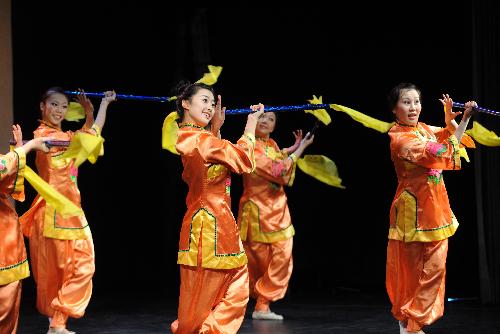 Students of the art troupe of China&apos;s Northeast Normal University perform a Man ethnic dance at the Nicolas Salmeron Culture Center in Madrid, capital of Spain, Jan. 27, 2010. [Xinhua]