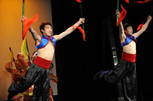 Students of the art troupe of China&apos;s Northeast Normal University perform a Man ethnic dance at the Nicolas Salmeron Culture Center in Madrid, capital of Spain, Jan. 27, 2010. [Xinhua]