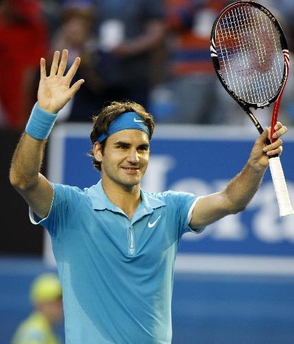 Roger Federer of Switzerland gestures to spectators after defeating Nikolay Davydenko of Russia during their quarter-final match of men's singles at 2010 Australian Open Tennis Championship at Rod Laver Arena in Melbourne, Australia, Jan. 27, 2010. Federer won 3-1. [Xinhua/Wang Lili]