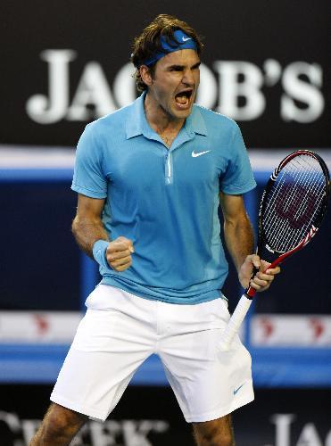 Roger Federer of Switzerland celebrates for defeating Nikolay Davydenko of Russia during their quarter-final match of men's singles at 2010 Australian Open Tennis Championship at Rod Laver Arena in Melbourne, Australia, Jan. 27, 2010. Federer won 3-1. 