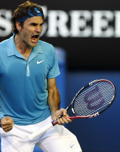 Roger Federer of Switzerland celebrates for defeating Nikolay Davydenko of Russia during their quarter-final match of men's singles at 2010 Australian Open Tennis Championship at Rod Laver Arena in Melbourne, Australia, Jan. 27, 2010. Federer won 3-1.
