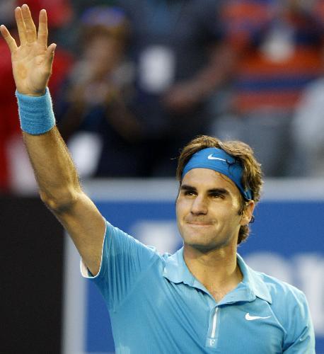 Roger Federer of Switzerland gestures to spectators after defeating Nikolay Davydenko of Russia during their quarter-final match of men's singles at 2010 Australian Open Tennis Championship at Rod Laver Arena in Melbourne, Australia, Jan. 27, 2010. Federer won 3-1. 