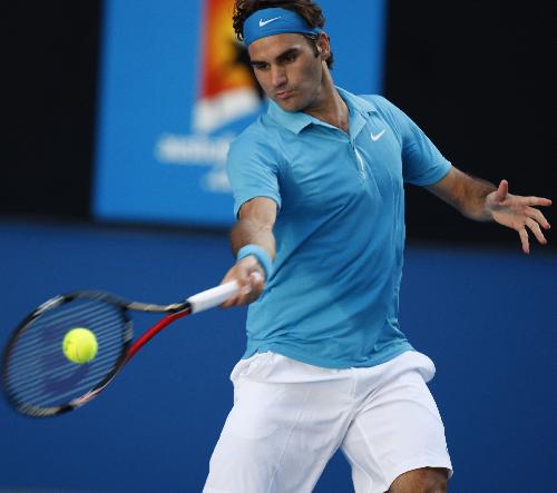 Roger Federer of Switzerland hits a return during the quarter-final match of men's singles against Nikolay Davydenko of Russia at 2010 Australian Open Tennis Championship at Rod Laver Arena in Melbourne, Australia, Jan. 27, 2010. Federer won 3-1.