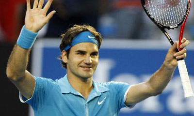 Federer downs Davydenko to reach semis