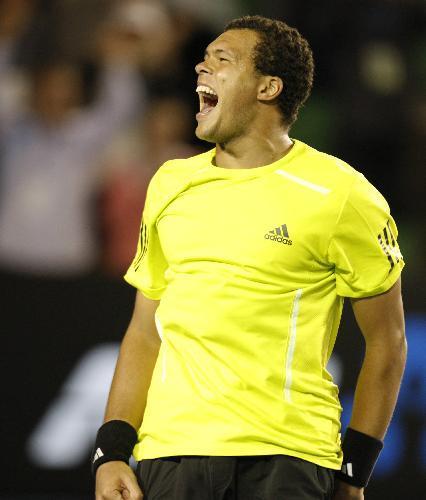 Jo-Wilfried Tsonga of France celebrates the victory after the quarter-final match of men's singles against Novak Djokovic of Serbia at 2010 Australian Open Tennis Championship at Rod Laver Arena in Melbourne, Australia, Jan. 27, 2010. Tsonga won 3-2. (Xinhua/Wang Lili)