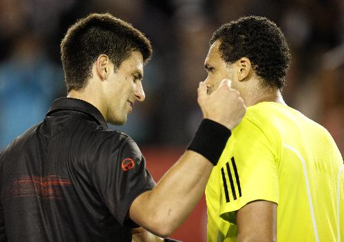 Jo-Wilfried Tsonga (R) of France is congratulated by Novak Djokovic of Serbia after their quarter-final match of men's singles at 2010 Australian Open Tennis Championship at Rod Laver Arena in Melbourne, Australia, Jan. 27, 2010. (Xinhua/Wang Lili)