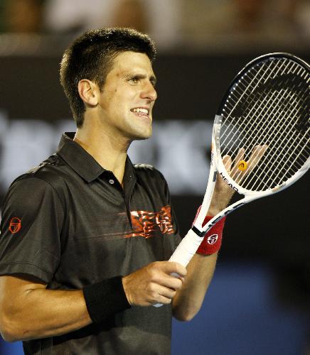 Novak Djokovic of Serbia reacts during the quarter-final match of men's singles against Jo-Wilfried Tsonga of France at 2010 Australian Open Tennis Championship at Rod Laver Arena in Melbourne, Australia, Jan. 27, 2010. Djokovic lost 2-3. (Xinhua/Wang Lili)