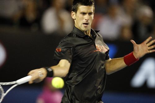 Novak Djokovic of Serbia hits a return during the quarter-final match of men's singles against Jo-Wilfried Tsonga of France at 2010 Australian Open Tennis Championship at Rod Laver Arena in Melbourne, Australia, Jan. 27, 2010. (Xinhua/Wang Lili)