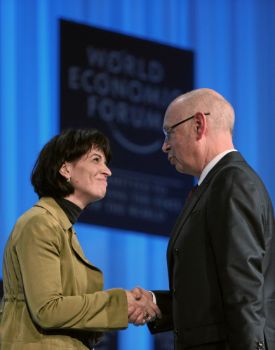 Doris Leuthard, President of the Swiss Confederation and Federal Councillor of Economic Affairs shakes hands with Klaus Schwab, Founder and Executive Chairman, World Economic Forum, during the 'Opening Plenary of the World Economic Forum Annual Meeting 2010' of the Annual Meeting 2010 of the World Economic Forum in Davos, Switzerland, January 27, 2010 at the Congress Centre.