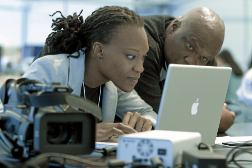 Journalists work on their computers at the media centre during the Annual Meeting 2010 of the World Economic Forum in Davos, Switzerland, January 27, 2010.