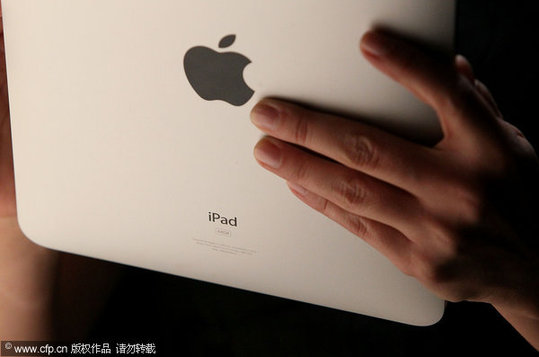 An event guest plays with the new Apple iPad during an Apple Special Event at Yerba Buena Center for the Arts January 27, 2010 in San Francisco, California. CEO Steve Jobs and Apple Inc. introduced its latest creation, the iPad, a mobile tablet browsing device that is a cross between the iPhone and a MacBook laptop. 