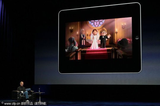 Apple Inc. CEO Steve Jobs demonstrates the movie function of the new iPad as he speaks during an Apple Special Event at Yerba Buena Center for the Arts January 27, 2010 in San Francisco, California. Apple introduced its latest creation, the iPad, a mobile tablet browsing device that is a cross between the iPhone and a MacBook laptop. [CFP]