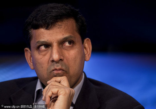 Raghuram Rajan, a professor of finance at the University of Chicago, listens during a panel discussion on day one of the 2010 World Economic Forum (WEF) annual meeting in Davos, Switzerland, on Wednesday, Jan. 27, 2010. [CFP]