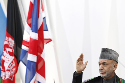 Afghanistan&apos;s President Hamid Karzai gestures as he arrives at the &apos;Afghanistan: The London Conference&apos;, in London January 28, 2010. (Xinhua/Reuters Photo)