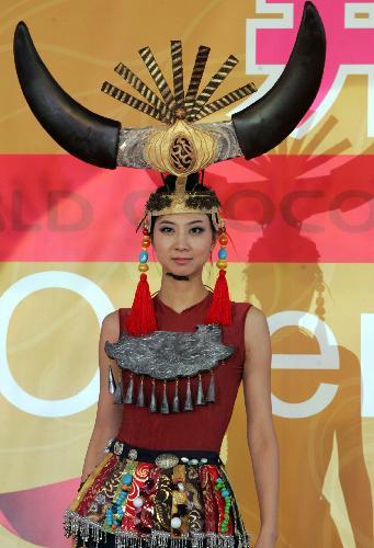 A model wears creations made of chocolate at the chocolate theme park in Beijing, China, Jan. 28, 2010. The 20,000-square-metre (215,000 square-foot) &apos;chocolate wonderland&apos; will open to the public on January 29. [Xinhua] 