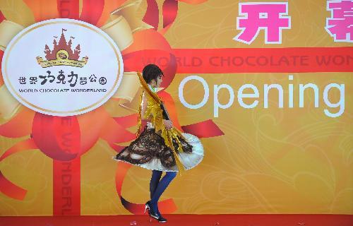 A model wears creations made of chocolate at the chocolate theme park in Beijing, China, Jan. 28, 2010. The 20,000-square-metre (215,000 square-foot) &apos;chocolate wonderland&apos; will open to the public on January 29. [Xinhua] 