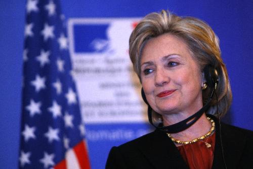 U.S. Secretary of State Hillary Clinton smiles during a press conference held jointly with French Foreign Minister Bernard Kouchner in Paris Jan. 29, 2010. [Zhang Yuwei/Xinhua]