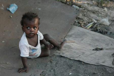 A Kid sits in a refugee in Port au Prince, Haiti, Jan. 21, 2010. [Ubaldo Gonzalez/Xinhua]