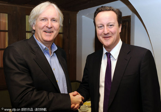Leader of the British Conservative Party David Cameron meets film Director James Cameron at the Davos World Economic Forum. [CFP]