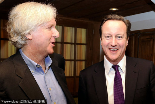 Leader of the British Conservative Party David Cameron meets film Director James Cameron at the Davos World Economic Forum. [CFP]