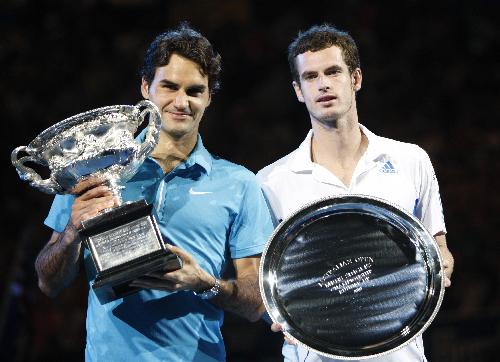 Roger Federer (L) of Switzerland poses with Andy Murray of Britain with their trophies during the awarding ceremony after the final match of men&apos;s singles at 2010 Australian Open Tennis Championship at Rod Laver Arena in Melbourne, Australia, Jan. 31, 2010. Federer won 3-0. [Xinhua]