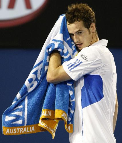 Andy Murray of Great Britain wipes his face during the final match of men&apos;s singles against Roger Federer of Switzerland at 2010 Australian Open Tennis Championship at Rod Laver Arena in Melbourne, Australia, Jan. 31, 2010. Murray lost 0-3. [Xinhua]