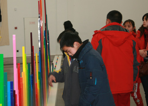 Children are looking at an art production in UCCA on Jan 31 2010.[China.org.cn]
