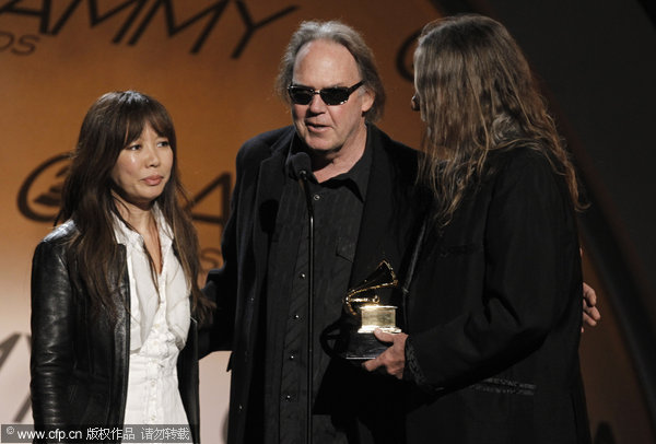 Jenice Heo (left), Neil Young (center), and Gary Burden accept the award for best boxed or limited edition for &apos;Neil Young Archives Vol. 1&apos; at the 52nd Grammy Awards on Sunday, Jan. 31, 2010, in Los Angeles.