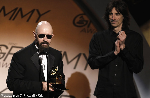 Rob Halford, of Judas Priest, accepts the award for best metal performance for 'Dissident Aggressor' at the 52nd Grammy Awards on Sunday, Jan. 31, 2010, in Los Angeles. 