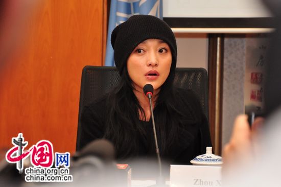Zhou Xun, renowned actress and UNDP China's National Goodwill Ambassador, attends an emergency briefing session held today. [Maverick Chen/China.org.cn] 