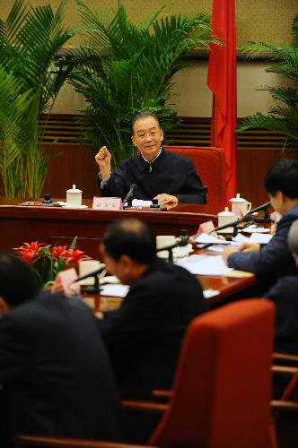Chinese Premier Wen Jiabao presides over a meeting on the government's work report in Beijing Jan. 26, 2010. The Premier presided over five meetings from Jan. 22 to Feb. 1, to solicit opinions from representatives and experts from democratic parties, business circles and various citizen groups on the government's work report, which is to be submitted at the upcoming annual session of the National People's Congress. [Xinhua]