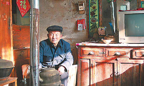 Zhu Yunxiang, 78, the grandfather of Zhu Yu, one of the workers allegedly cheated by the job agency. 