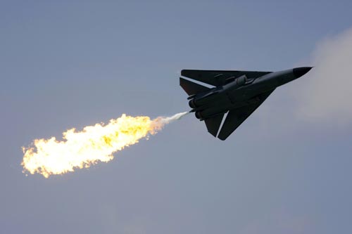 A Royal Australian Air Force (RAAF) F-111 Aardvark jet performs a &apos;dump-and-burn&apos; fuel dump during the Singapore Airshow February 2, 2010. The RAAF will be retiring their F-111s in 2010.