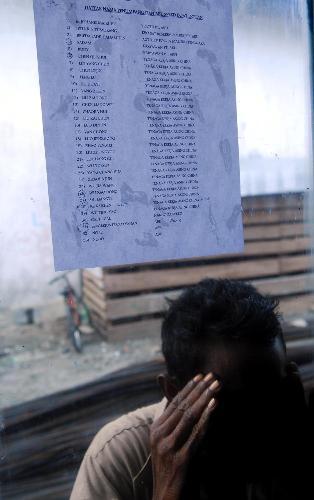 A name list of the missing is seen at the rescue center in Moluccas islands in eastern Indonesia, Feb. 2, 2010. Rescuers continued to search for the 23 missing passengers of the sunken Dolphin speed boat off Moluccas islands on Tuesday. There were more than 30 people including 24 Chinese citizens on board the Dolphin speed boat when it sank on Jan. 27. [Xinhua/Yue Yuewei]