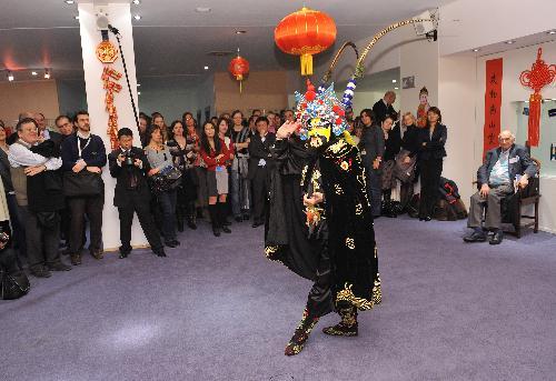 An actor performs China's Sichuan Opera face change during a cultural presentation of the Chinese lunar new year at the European Parliament headquarters in Brussels, capital of Belgium, Feb. 2, 2010. 